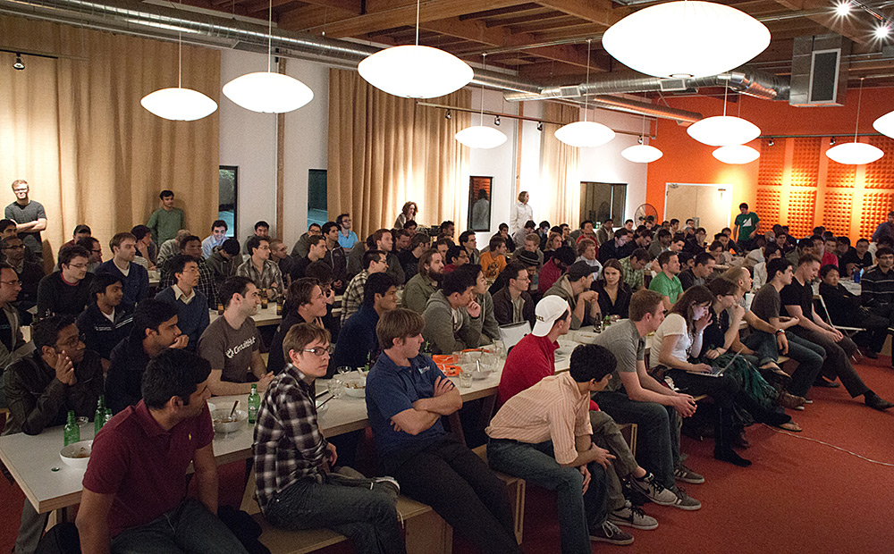 attendees of ycombinator sitting in a conference