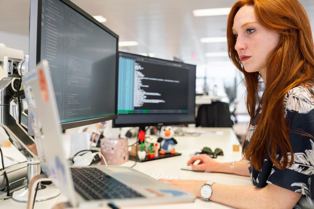 Female developer working using traditional development